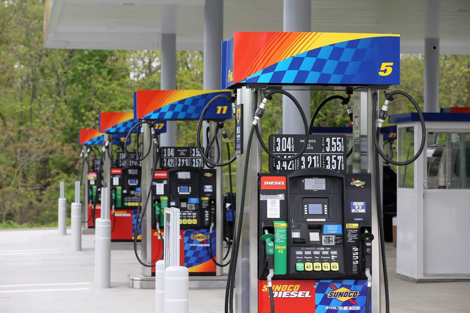 Fuel pumps beneath a gas-station canopy